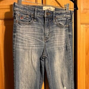 Hollister Women's Blue Jeans flare unfinished hem with left knee distressed